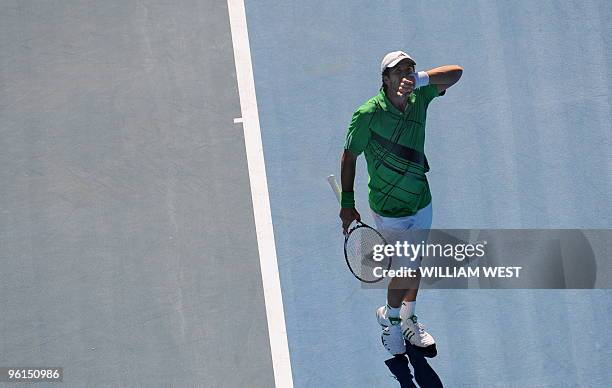 Fernando Verdasco of Spain gestures during his loss to Nikolay Davydenko of Russia in their men's singles fourth round match on day eight of the...