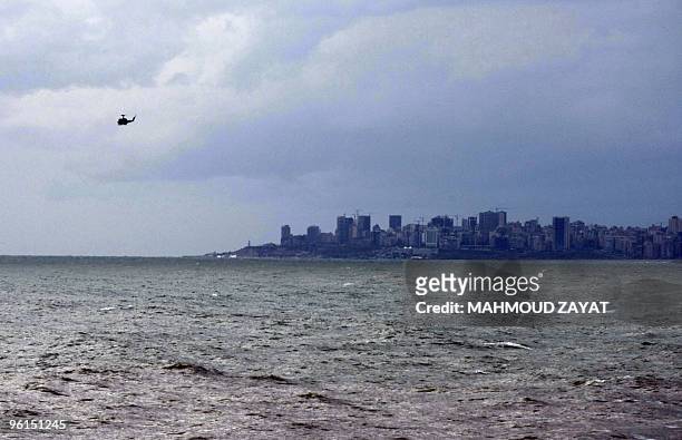 Lebanese Army helicopter scans the sea off the Mediterranean coast south of the capital Beirut on January 25, 2010 following the crash of an...