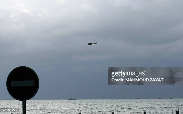 Lebanese army helicopter and United Nations and other vessels scan the sea off the Lebanese coast south of the capital Beirut on January 25, 2010...