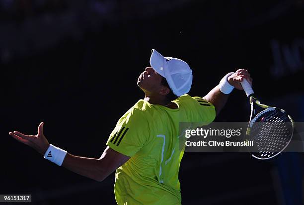 Jo-Wilfried Tsonga of France serves in his fourth round match against Nicolas Almagro of Spain during day eight of the 2010 Australian Open at...