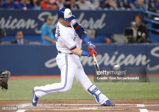Josh Donaldson of the Toronto Blue Jays hits a double in the first inning during MLB game action against the Los Angeles Angels of Anaheim at Rogers...