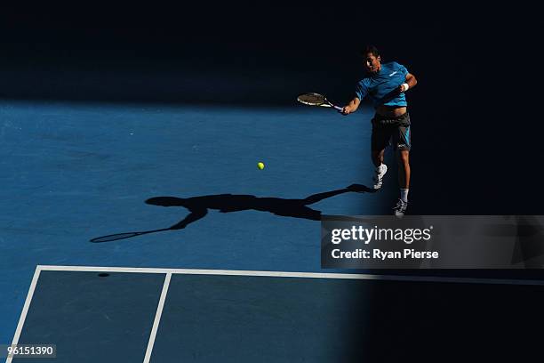 Nicolas Almagro of Spain plays a forehand in his fourth round match against Jo-Wilfried Tsonga of France during day eight of the 2010 Australian Open...