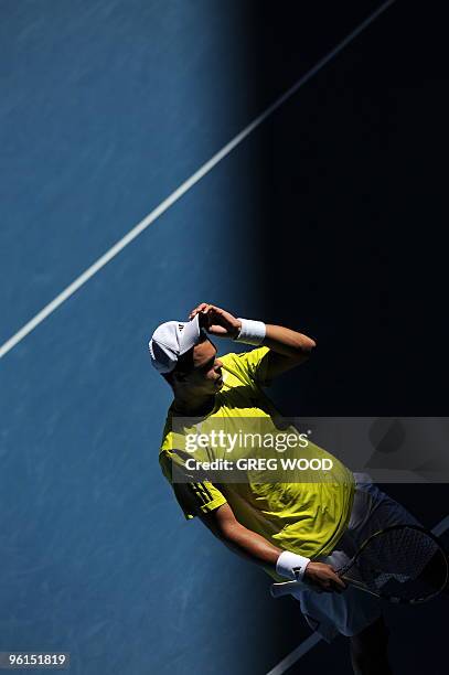 French tennis player Jo-Wilfried Tsonga gestures during his fourth round mens singles match against Spanish opponent Nicolas Almagro at the...