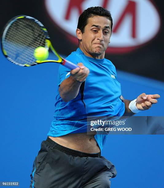 Spanish tennis player Nicolas Almagro plays a forehand return during his fourth round mens singles match against French opponent Jo-Wilfried Tsonga...