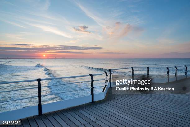 sunset at saltburn pier, north yorkshire, england - cirrus ストックフォトと画像