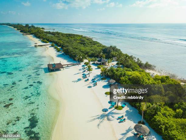 aerial view of canareef resort maldives, herathera island, addu atoll - maldives beach stock pictures, royalty-free photos & images
