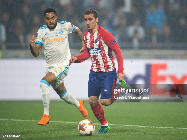 Antoine Griezmann of Atletico Madrid closes in on his second goal of the match chased by Jordan Amavi of Marseille during the UEFA Europa League...