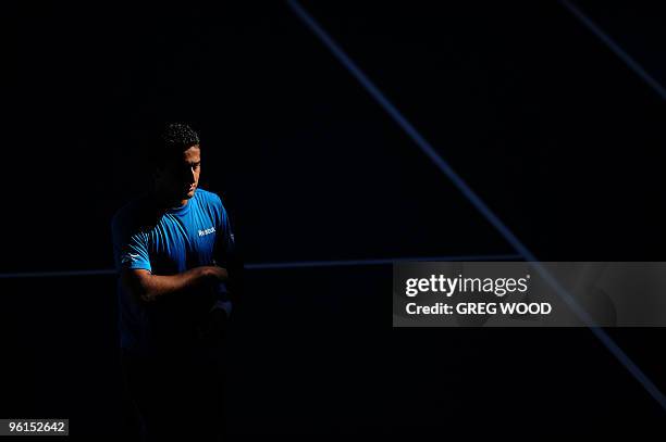 Spanish tennis player Nicolas Almagro walks on court during his fourth round mens singles match against French opponent Jo-Wilfried Tsonga at the...