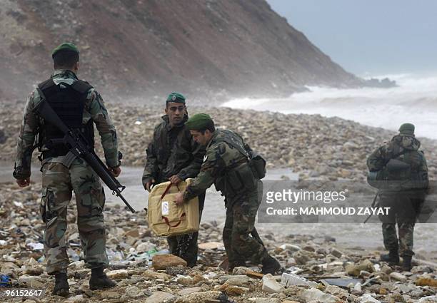 Lebanese army troops inspect the debris of an Ethiopian Boeing 737 that crashed off the Lebanese coast, south of the capital Beirut, on January 25,...