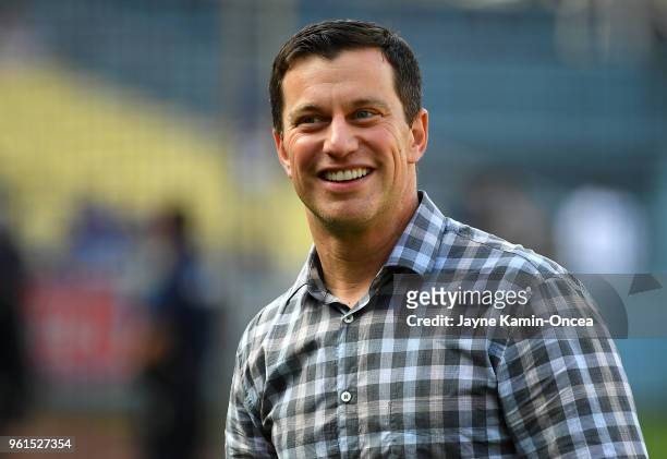 Andrew Friedman, President of Baseball Operations for the Los Angeles Dodgers, walks on the field before the game against the Colorado Rockies at...