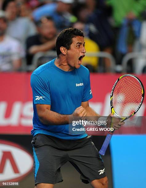 Spanish tennis player Nicolas Almagro shouts as he celebrates winning the fourth set during his fourth round mens singles match against French...