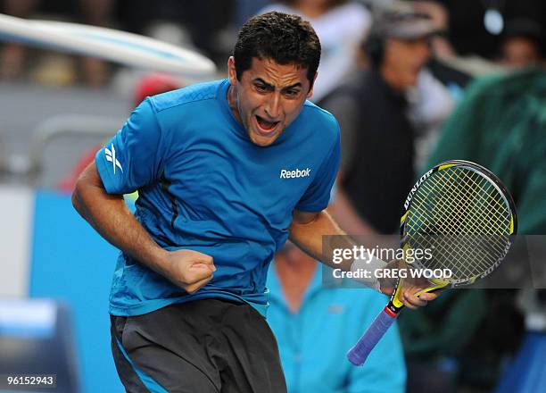Spanish tennis player Nicolas Almagro gestures as he celebrates winning a point during his fourth round mens singles match against French opponent...