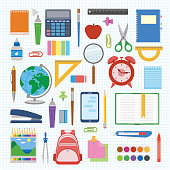 School supplies and items set on a sheet in a cell. Back to school equipment. Education workspace accessories on white background