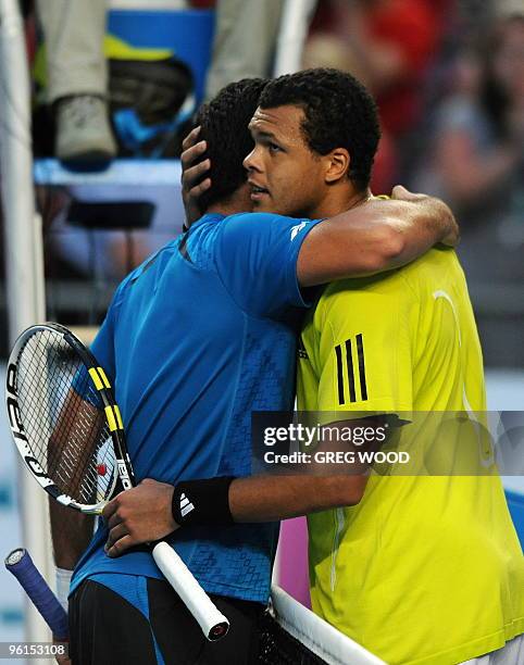 French tennis player Jo-Wilfried Tsonga embraces Spanish opponent Nicolas Almagro after their fourth round mens singles match at the Australian Open...