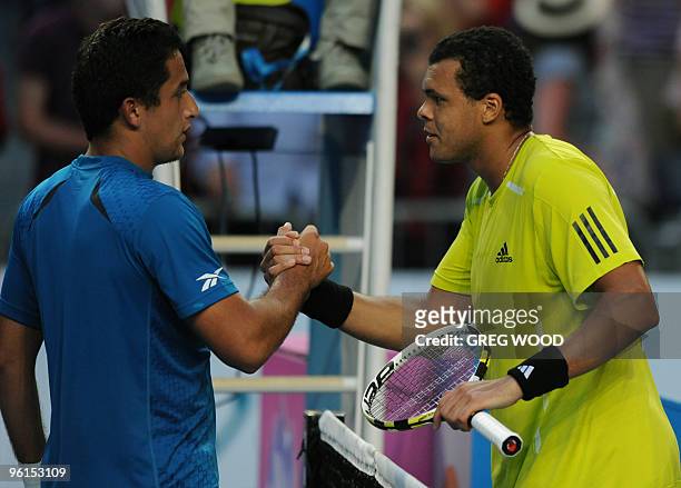 French tennis player Jo-Wilfried Tsonga shakes hands with Spanish opponent Nicolas Almagro after their fourth round mens singles match at the...