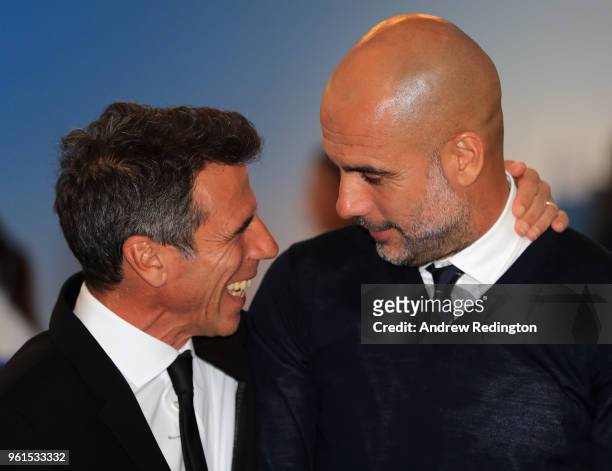 Football greats Gianfranco Zola and Pep Guardiola share a joke during An Evening With Mike Rutherford, The Mechanics and Friends at the BMW PGA...