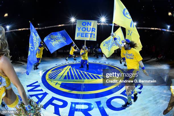 Golden State Warriors flag men excite the crowd before the game against the Houston Rockets during Game Four of the Western Conference Finals during...