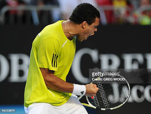 French tennis player Jo-Wilfried Tsonga celebrates winning a point during his fourth round mens singles match against Spanish opponent Nicolas...
