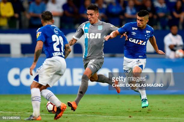 Lucas Romero and Egidio of Brazil's Cruzeiro vie for the ball with Ricardo Centurion of Argentina's Racing Club during their 2018 Copa Libertadores...