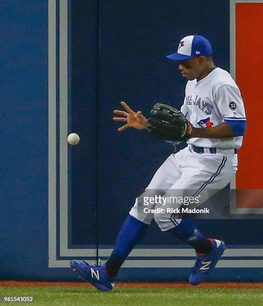 Toronto Blue Jays left fielder Curtis Granderson looks to gather a ball hit hard into the corner. Toronto Blue Jays Vs Los Angeles Angels in MLB...