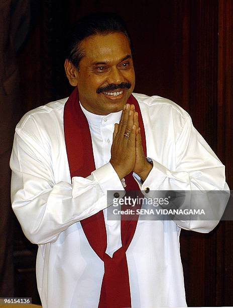 Sri Lanka's newly-elected President Mahinda Rajapakse greets supporters after being sworn in Colombo, 19 November 2005. Rajapakse offered talks with...