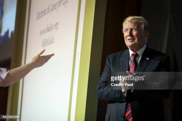 President Donald Trump walks onstage to speak at the Susan B Anthony List gala at the National Building Museum on May 22, 2018 in Washington, DC....