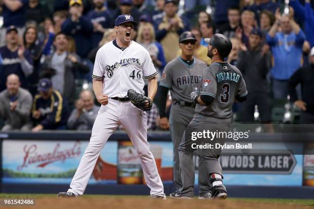 Corey Knebel of the Milwaukee Brewers celebrates after Daniel Descalso of the Arizona Diamondbacks grounded out to end the game to give the Milwaukee...