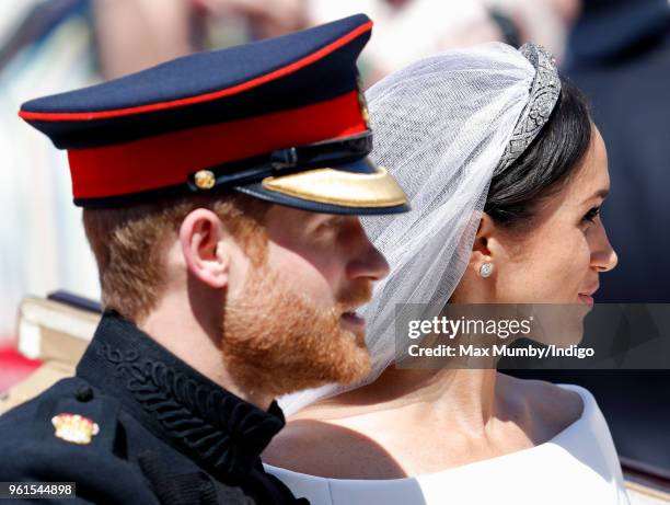 Prince Harry, Duke of Sussex and Meghan, Duchess of Sussex travel in an Ascot Landau carriage as they begin their procession through Windsor...