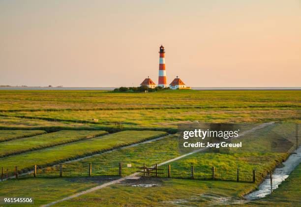 westerhever lighthouse at sunset - red beacon stock pictures, royalty-free photos & images