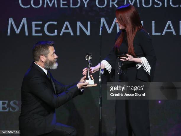 Megan Mullally receives award from Nick Offerman onstage at the 43rd Annual Gracie Awards at the Beverly Wilshire Four Seasons Hotel on May 22, 2018...