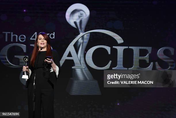 Actress Megan Mullally accepts the award for best supporting actress in a comedy or musical, on stage at the 43nd Annual Gracie Awards, May 22, 2018...