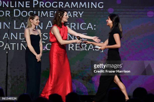 Katy Colloton and Katie O'Brien present an award to Andrea Patino Contreras onstage at the 43rd Annual Gracie Awards at the Beverly Wilshire Four...
