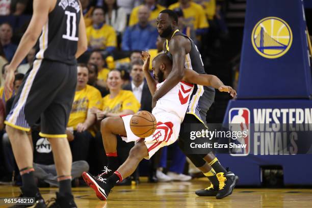 Chris Paul of the Houston Rockets collides with Draymond Green of the Golden State Warriors during Game Four of the Western Conference Finals of the...