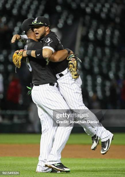 Jose Abreu of the Chicago White Sox lifts up Yolmer Sanchez after Sanchez got the game winning hit after the game against the Baltimore Orioles at...