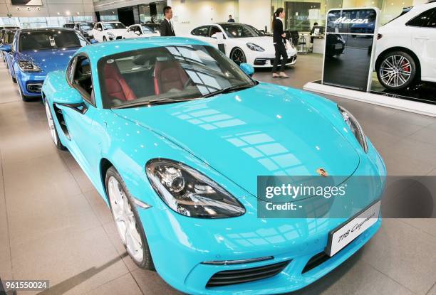 This photo taken on May 22, 2018 shows an imported Porsche 718 Cayman car displayed at a showroom in Nantong in China's eastern Jiangsu province. -...
