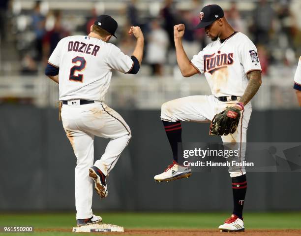 Brian Dozier and Byron Buxton of the Minnesota Twins celebrate defeating the Detroit Tigers 6-0 on May 22, 2018 at Target Field in Minneapolis,...