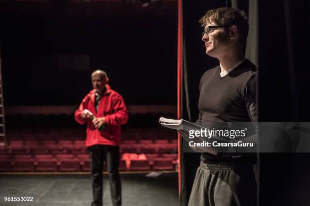 actor holding script during theatrical rehearsal - actor script stock pictures, royalty-free photos & images