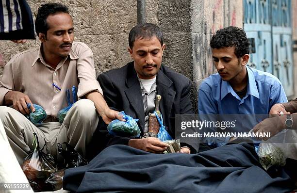 Yemenis prepare for their daily ritual of cheqing qat, the narcotic leaves of an evergreen shrub, in a street in Sanaa January 25, 2010. The United...