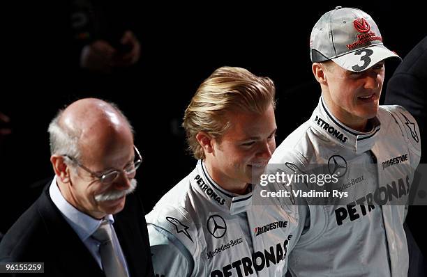 Daimler AG chairman Dieter Zetsche, Nico Rosberg and Michael Schumacher of Germany and Mercedes GP pose for a photo during the Mercedes GP Petronas...