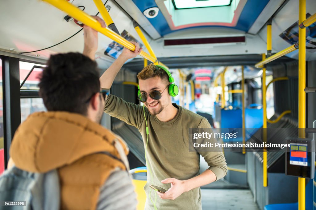 Man In The Bus Two Men Are Standing On A Bus High-Res Stock Photo - Getty Images