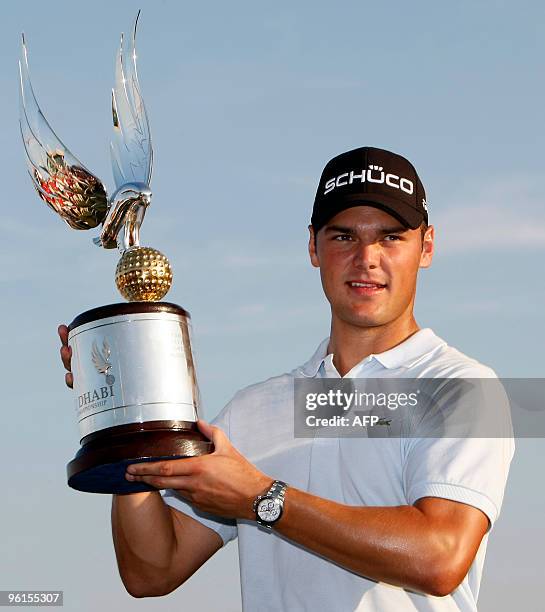 Martin Kaymer of Germany poses with the trophy after winning the 1.5 million euro Abu Dhabi Golf Championship for the second time in three years on...