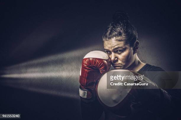 portrait of young woman boxer - boxing womens stock pictures, royalty-free photos & images