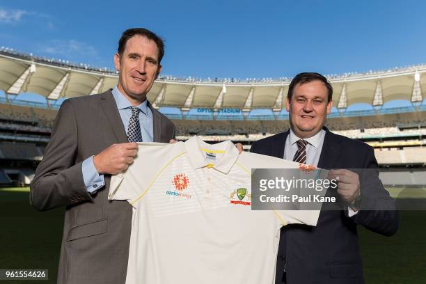 Cricket Australia CEO James Sutherland and Alinta Energy CEO Jeff Dimery pose with an Alinta Energy branded playing shirt at Optus Stadium on May 23,...