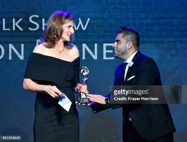 Edgar Sotelo presents an award to Jill Schlesinger onstage at the 43rd Annual Gracie Awards at the Beverly Wilshire Four Seasons Hotel on May 22,...