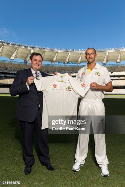 Alinta Energy CEO Jeff Dimery and Ashton Agar of the Australian Cricket Team pose with an Alinta Energy branded playing shirt at Optus Stadium on May...