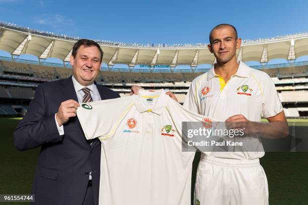 Alinta Energy CEO Jeff Dimery and Ashton Agar of the Australian Cricket Team pose with an Alinta Energy branded playing shirt at Optus Stadium on May...