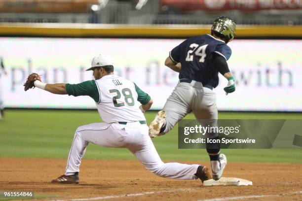 Miami third baseman Ray Gil gets Notre Dame outfielder Matt Vierling out during the ACC Baseball Championship game between the Notre Dame Fighting...