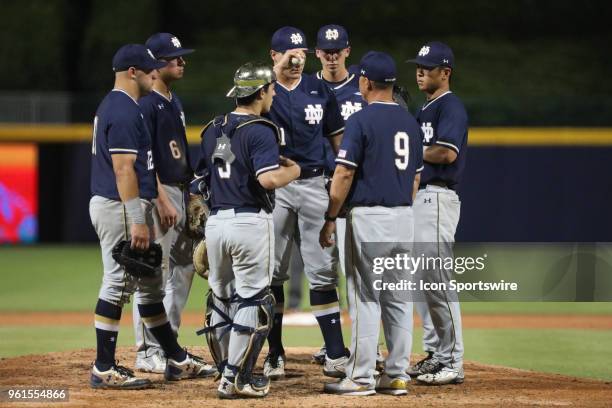 Notre Dame pitcher Andrew Belcik on the mound with the rest of his teammates and Head Coach Mike Aoki during the ACC Baseball Championship game...