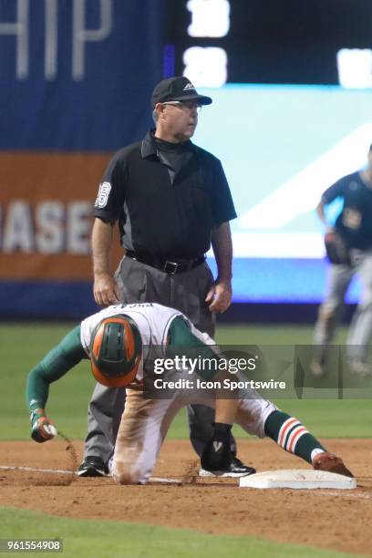 Miami infielder Willy Escala gets out during the ACC Baseball Championship game between the Notre Dame Fighting Irish and the Miami Hurricanes on May...