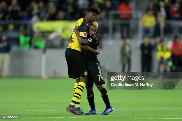 Latif Blessing of Los Angeles FC hugs Dan-Axel Zagadou of Borussia Dortmund after an International friendly soccer match at Banc of California...